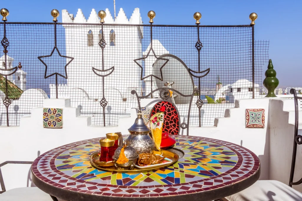 Traditional Moroccan tea served on a decorated table.